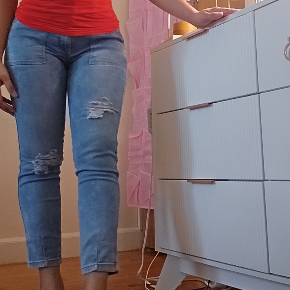 Red Sleeveless Top and Distressed Jeans